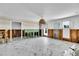 Bright living room highlighting decorative marble flooring and modern window frames at 25 Dolphin Dr, Treasure Island, FL 33706
