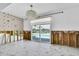Spacious living room showcasing water view from glass sliding doors to pool at 25 Dolphin Dr, Treasure Island, FL 33706