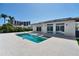 Beautiful outdoor pool and patio area with direct access to the home through sliding glass doors at 25 Dolphin Dr, Treasure Island, FL 33706