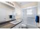 Clean bathroom featuring a vanity with white cabinets and a combination tub and shower, offering a practical and well-maintained space at 25337 Durango Ct, Punta Gorda, FL 33955