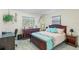 Inviting bedroom with a wooden bed frame, decorative wall art, and coordinated furnishings, creating a warm and personalized space at 25337 Durango Ct, Punta Gorda, FL 33955