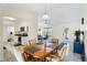 View of dining room featuring light fixture and transition into a living room area at 25337 Durango Ct, Punta Gorda, FL 33955