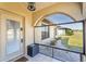The front porch and entry area features a security door and tile flooring at 25337 Durango Ct, Punta Gorda, FL 33955