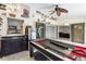 Entertaining game room equipped with wet bar, refrigerator, pool table and outdoor views at 25337 Durango Ct, Punta Gorda, FL 33955
