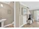 Neutral toned bathroom with pedestal sink and tile flooring at 2897 Thaxton Dr # 62, Palm Harbor, FL 34684