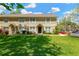 Inviting townhome with a well-manicured lawn and charming architectural details on a sunny day at 2897 Thaxton Dr # 62, Palm Harbor, FL 34684