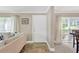 Bright and open living room shows hardwood flooring and a view to dining room at 2897 Thaxton Dr # 62, Palm Harbor, FL 34684