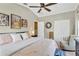 Spacious bedroom featuring a ceiling fan, closet, and stylish decor at 2897 Thaxton Dr # 62, Palm Harbor, FL 34684