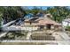 Aerial view of the home with solar panels, fenced yard, and well-maintained landscaping at 3443 16Th Ave S, St Petersburg, FL 33711
