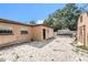 Large backyard area features a mix of sand and gravel offering versatility for various landscaping options at 3443 16Th Ave S, St Petersburg, FL 33711