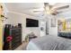 Neutral bedroom with a ceiling fan, large mirror closet, and flat screen TV at 3443 16Th Ave S, St Petersburg, FL 33711