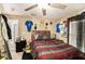 Inviting bedroom with comfortable bed, ceiling fan, and a window bringing in natural light at 3443 16Th Ave S, St Petersburg, FL 33711
