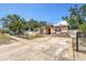 Inviting home with a spacious driveway and decorative stone accents on the facade at 3443 16Th Ave S, St Petersburg, FL 33711