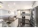 Modern kitchen boasting stainless steel appliances, a large island with seating, and ample cabinet space at 3443 16Th Ave S, St Petersburg, FL 33711