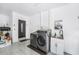 Convenient laundry room with modern washer and dryer, sink, and ample space near the entrance at 3443 16Th Ave S, St Petersburg, FL 33711