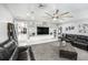 Bright living room boasts sleek built-ins, modern fan and decor, and comfortable seating at 3443 16Th Ave S, St Petersburg, FL 33711