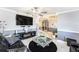 Bright living room featuring a fireplace, modern decor, stylish seating, and gray walls at 3443 16Th Ave S, St Petersburg, FL 33711