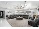 Spacious living room featuring an expansive seating area, modern decor, and ample natural light at 3443 16Th Ave S, St Petersburg, FL 33711