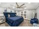 Cozy bedroom featuring a plush blue bed, decorative ceiling, and access to closet at 3443 16Th Ave S, St Petersburg, FL 33711