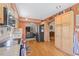 Well-appointed kitchen featuring ample cabinetry, stainless steel appliances, and hardwood floors at 3626 Lake Joyce Dr, Land O Lakes, FL 34639