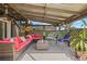 Cozy covered patio with comfortable seating area, perfect for outdoor relaxation and entertaining at 3626 Lake Joyce Dr, Land O Lakes, FL 34639