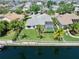 This is an aerial view of the house, backyard, pool, and the canal at 4604 Blue Marlin Dr, Bradenton, FL 34208