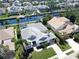 Stunning aerial view of a home with a pool along a canal at 4604 Blue Marlin Dr, Bradenton, FL 34208