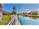 Waterfront backyard with access to canal, dock, boat, and serene water views at 4604 Blue Marlin Dr, Bradenton, FL 34208
