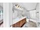 Bathroom with vanity, large mirror, and shower-tub combo at 4604 Blue Marlin Dr, Bradenton, FL 34208