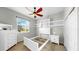 Cozy bedroom with modern furniture, ample natural light, and a ceiling fan at 4604 Blue Marlin Dr, Bradenton, FL 34208