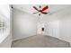 Bright bedroom with a ceiling fan, closet, and view to the connected bathroom at 4604 Blue Marlin Dr, Bradenton, FL 34208