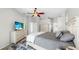 Comfortable bedroom featuring stylish decor, a ceiling fan, and an ensuite bathroom at 4604 Blue Marlin Dr, Bradenton, FL 34208