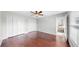 Spacious bedroom with hardwood floors, ceiling fan, and ample closet space at 4604 Blue Marlin Dr, Bradenton, FL 34208