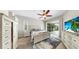 Comfortable bedroom with an ensuite bathroom and a door leading to an outdoor screened porch at 4604 Blue Marlin Dr, Bradenton, FL 34208