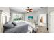 Comfortable bedroom with sliding doors to a private pool, ceiling fan, and neutral decor at 4604 Blue Marlin Dr, Bradenton, FL 34208