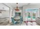 Cozy dining area with a round table and chairs, and a sliding glass door overlooking the pool at 4604 Blue Marlin Dr, Bradenton, FL 34208