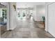Bright, open foyer with tile flooring, views of the pool area, and arched doorways leading to other rooms at 4604 Blue Marlin Dr, Bradenton, FL 34208