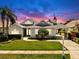 Beautiful home featuring lush lawn, gray roof, and manicured flower beds at 4604 Blue Marlin Dr, Bradenton, FL 34208