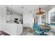 Kitchen area featuring an eat-in space with blue chairs and modern lighting at 4604 Blue Marlin Dr, Bradenton, FL 34208