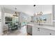 Bright kitchen featuring counter seating and views of the outdoor pool area at 4604 Blue Marlin Dr, Bradenton, FL 34208