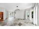 Open-concept living area showcasing tiled flooring and sliders to the exterior at 4604 Blue Marlin Dr, Bradenton, FL 34208