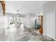Open-concept living room with tiled floors, sliding glass doors to the lanai, and dining area at 4604 Blue Marlin Dr, Bradenton, FL 34208