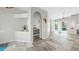 Living space with tile flooring, views to the pool, and access to the bedroom through an arched doorway at 4604 Blue Marlin Dr, Bradenton, FL 34208