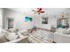 Comfortable living room featuring stylish decor, a ceiling fan, and an open layout at 4604 Blue Marlin Dr, Bradenton, FL 34208
