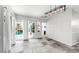 Bright living area with tile floors and sliding glass doors leading to a screened patio and pool at 4604 Blue Marlin Dr, Bradenton, FL 34208