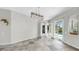 Bright living room with tiled floor and sliding doors to the lanai and pool area at 4604 Blue Marlin Dr, Bradenton, FL 34208