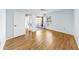 Bright bedroom featuring wood-look floors and a sliding door access to Florida room at 4851 Leyte Ct, New Port Richey, FL 34655