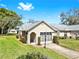 Charming single-story home featuring an attached carport, manicured lawn, and well-maintained landscaping at 4851 Leyte Ct, New Port Richey, FL 34655
