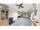 Spacious garage with epoxy flooring, overhead storage, and shelving units at 4851 Leyte Ct, New Port Richey, FL 34655