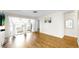 Open living room with lots of light and wood-look floors at 4851 Leyte Ct, New Port Richey, FL 34655